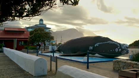 Golden-sunrise-sky-in-Hermanus-with-view-of-iconic-whale-sculpture-in-CBD