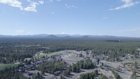 High-static-drone-shot-captures-the-distant-Three-Sisters-mountains-in-Bend,-Oregon