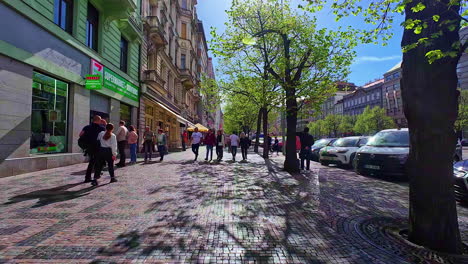 POV-shot-walking-through-a-commercial-street-of-Europe-on-a-sunny-day