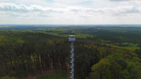 Panoramic-aerial-shooting-of-the-fire-tower-and-natural-landscape