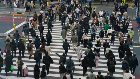 Shibuya-Crossing-In-Tokyo,-Japan-Crowded-With-Pedestrians-In-Daytime