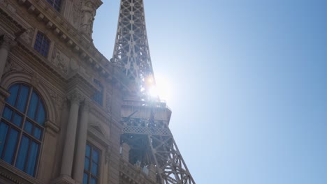 Low-angle-view-of-Eiffel-Tower-Restaurant-at-Paris-Las-Vegas-with-sun-flare