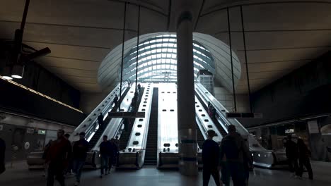 Silhouette-Of-Commuters-On-Escalators-At-Canary-Wharf-Underground-Station