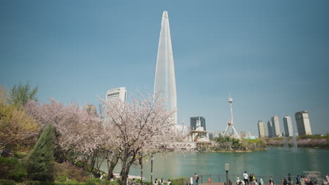 Luxury-Hotel-Of-Lotte-World-Tower-From-The-Seokchon-Lake-Park-In-Seoul,-South-Korea