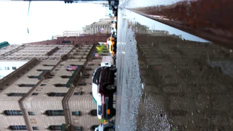 A-low-angle-shot-of-New-York's-Fifth-Avenue-on-a-rainy-day
