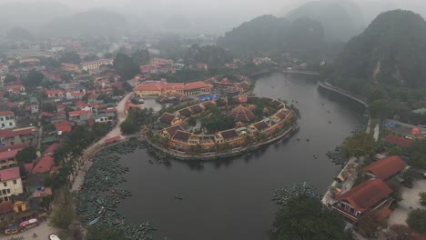 Aerial-Drone-Shot-of-House-In-Ninh-Binh-near-a-Lake