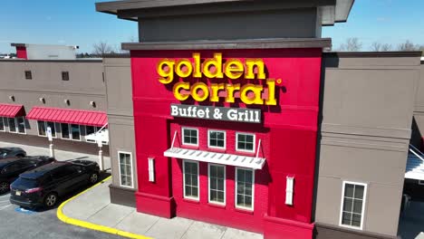 Aerial-approaching-shot-of-Golden-Corral-buffet-and-grill-in-american-town