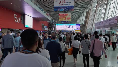 Huge-crowd-of-foreign-visitors-at-the-hall-of-Canton-fair-complex,-Guangzhou,-China