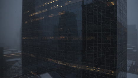 establishing-shot-of-a-corporate-high-rise-office-building-during-a-blizzard