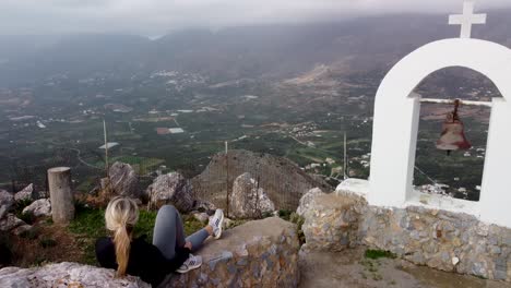 Hiker-Sits-on-Mountain-Top-and-Enjoys-Epic-360-Degree-Viewpoint---Greek-Island-of-Crete