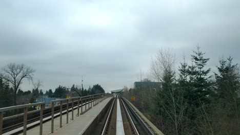 Skytrain-Moving-On-Railway-Towards-Subway-Station-In-Canada