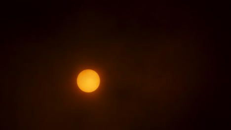 The-sun-with-thin-hazy-clouds-moving-in-front-of-it