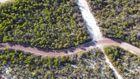 Drone-aerial-over-a-running-track-with-Australian-fauna-around-it