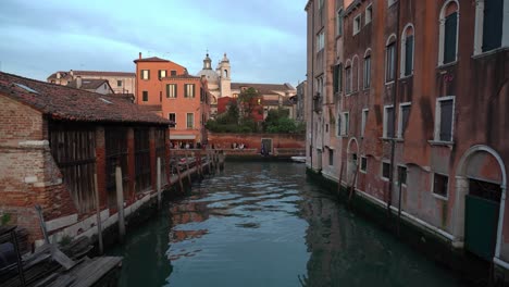 Italians-with-Friends-Enjoying-Evening-near-the-Water-Canal-in-Venice