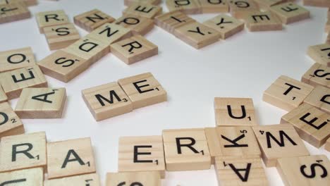 Drug-word-METH-formed-on-table-with-Scrabble-letter-tiles,-closeup