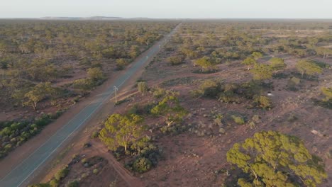Drone-clip-showing-long-straight-road-for-direct-shipping-through-remote-Australian-outback