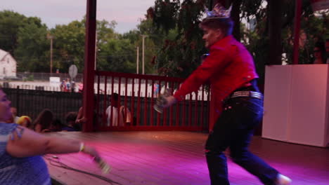 A-drag-king-gets-some-tips-from-the-audience-during-the-MidMo-PrideFest