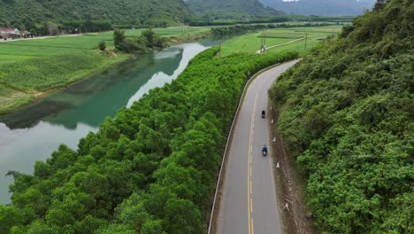 Aerial-Drone-Shot-of-Highway-Passing-Through-Hills-And-River-in-Side