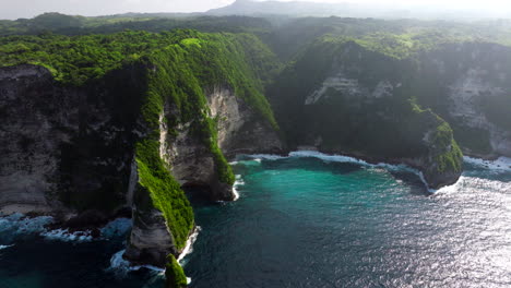 Stunning-aerial-wide-angle-view,-Cliffs-at-Nusa-Penida-Beach,-Indonesia