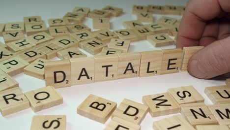 Scrabble-tile-letters-on-edge-form-words-DATA-and-LEAK-in-game-play