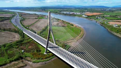Drone-traffic-crossing-The-Thomas-Francis-Meagher-Bridge-over-the-River-Suir-at-Waterford-Ireland-with-Comeragh-Mountains-in-the-background