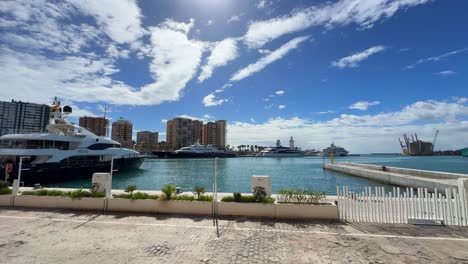 Marina-promenade-expensive-yacht-docked-at-Malaga-port-in-south-Spain