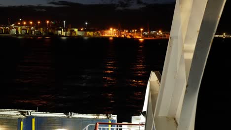 A-boat-leaving-the-port-at-night