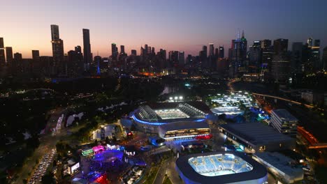 Aerial-drone-view-at-nighttime-of-the-Rod-Laver-and-Australian-Open-in-Melbourne,-Victoria,-Australia