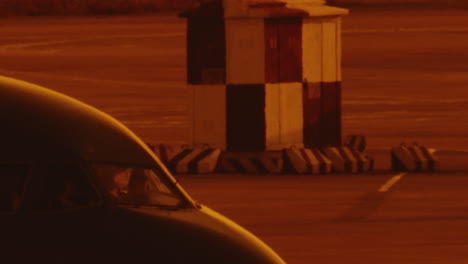 airplane-passenger-cockpit-waiting-on-airstrip-during-sunset-orange-light