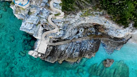 Steep-stairs-towards-the-beach-wind-along-a-rock