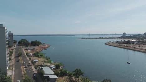 Stock-footage-capturing-the-vibrant-Posadas-skyline-against-the-tranquil-Parana-River,-ideal-for-conveying-the-beauty-of-urban-waterfront-living