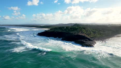 Flying-towards-Fingal-Head-Lighthouse-near-Fingal-in-New-South-Wales,-Australia---about-5-kilometres-south-of-Point-Danger-and-the-state-of-Queensland