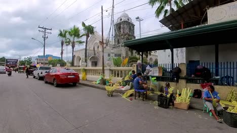 Pass-by-the-grand-Tagbilaran-Cathedral-in-Bohol,-Philippines,-from-a-tuk-tuk's-perspective,-capturing-its-stunning-façade