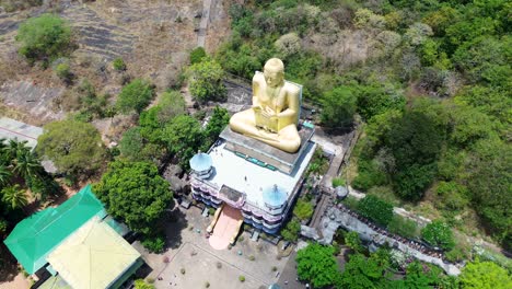 Aerial-drone-landscape-view-of-Golden-Buddha-statue-Dambulla-cave-temple-building-Spiritual-Religion-in-Sri-Lanka-Asia-travel-tourism