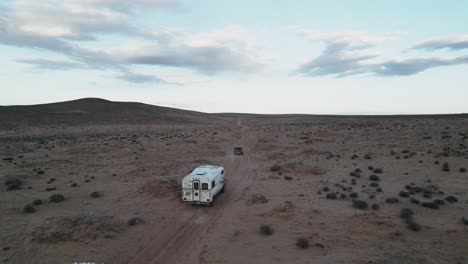 Adventure-with-the-camper-truck-driving-on-the-desert-road-in-Utah,-USA