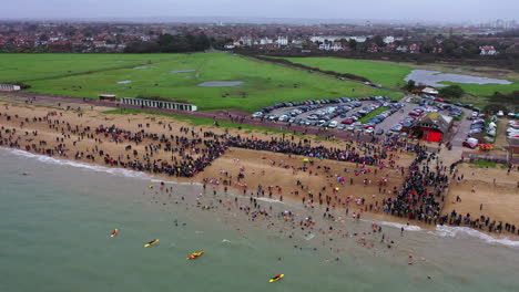 Aerial-panning-across-Gosport-New-Years-Day-Swim-UK-4K
