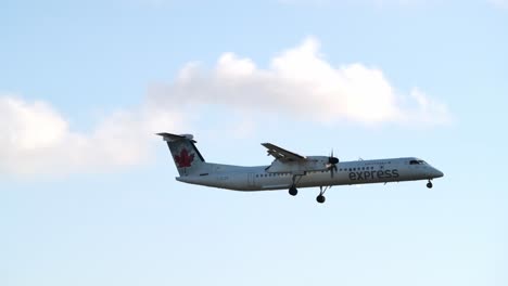 Air-Canada-Express-Plane-Flying-In-Richmond,-Canada---Tracking-Shot