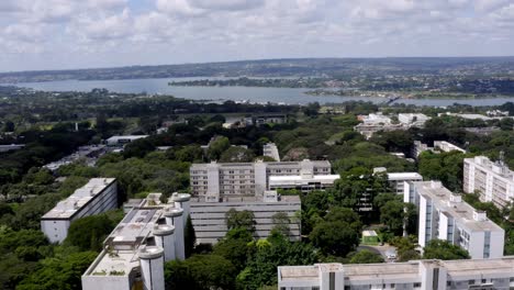 Superquadras,Apartment-Buildings-with-Lake-Paranoá-on-the-Horizon,-Brasilia,-Pull-Back-Aerial