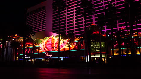 Las-Vegas-Boulevard-at-Night,-Strip-Traffic-in-Front-ot-Flamingo-Casino-Hotel,-Nevada-USA