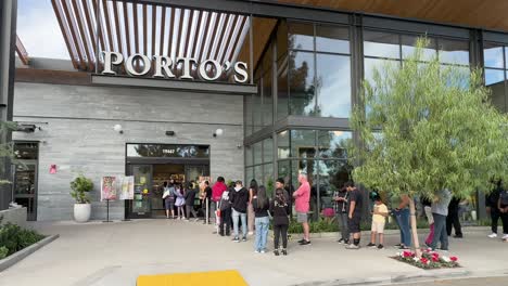 People-waiting-in-line-at-the-famous-Porto's-Bakery-and-Cafe-in-Northridge,-California