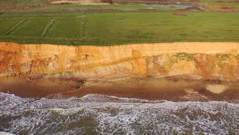 Aerial-birds-eye-view-Isle-of-Wight-beach-Sunny-day-UK-4K