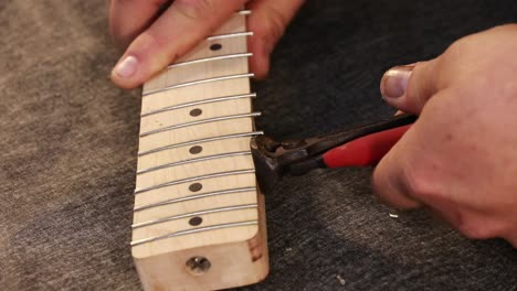 Frets-being-cut-on-new-guitar-neck