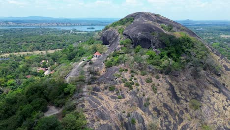 Aerial-drone-landscape-of-sacred-religious-royal-cave-palace-Golden-Temple-of-Dambulla-Rangiri-Sri-Lanka-Buddhist-philosophy-Spiritual-sanctuary-Asia