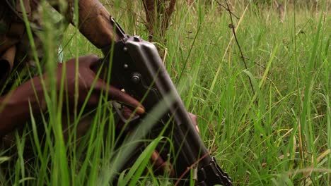 Close-up-soldier-holding-an-AK-47