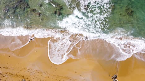 Birds-Eye-View-Looking-Down-on-Red-Beach,-Matala-Greece,-on-the-Island-of-Crete