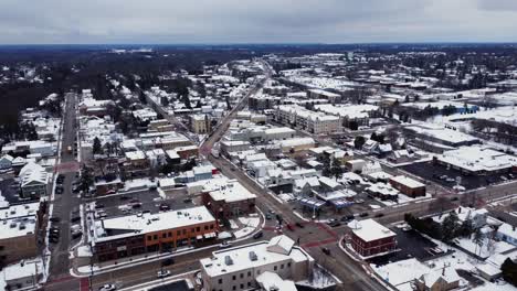 aerial-flyover-of-a-suburban-downtown-in-winter