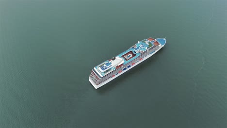 Aerial-view-of-large-luxurious-cruise-ship-sailing-in-Babitonga-Bay,-Brazil