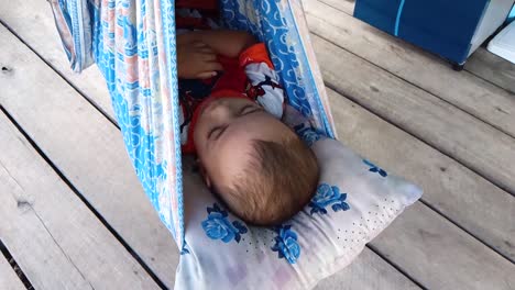 Little-baby-sleeping-in-a-swing