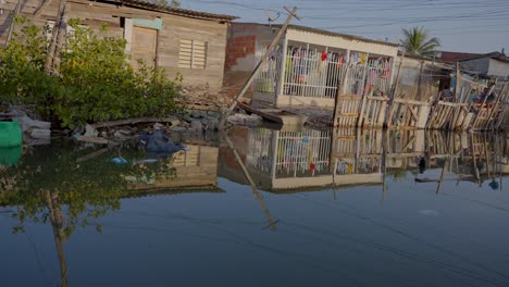 House-on-the-side-of-a-river-trying-to-stop-the-flood