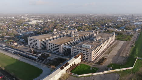 Aerial-footage-rotating-around-an-abandoned-warehouse-outside-of-New-Orleans,-Louisiana